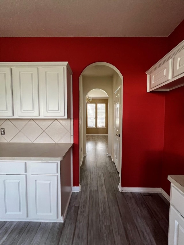 20019 Sterling Meadow Ct, Katy, TX 77449 - hall with arched walkways and dark wood finished floors