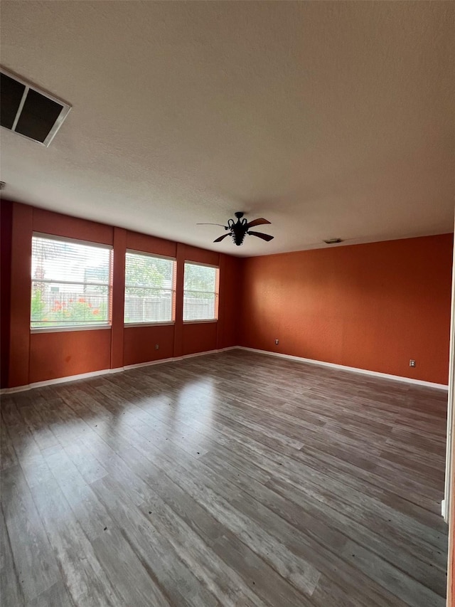 20019 Sterling Meadow Ct, Katy, TX 77449 - empty room featuring wood finished floors and a ceiling fan