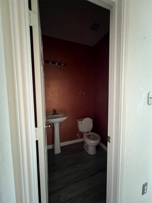 20019 Sterling Meadow Ct, Katy, TX 77449 - half bathroom with toilet and wood finished floors
