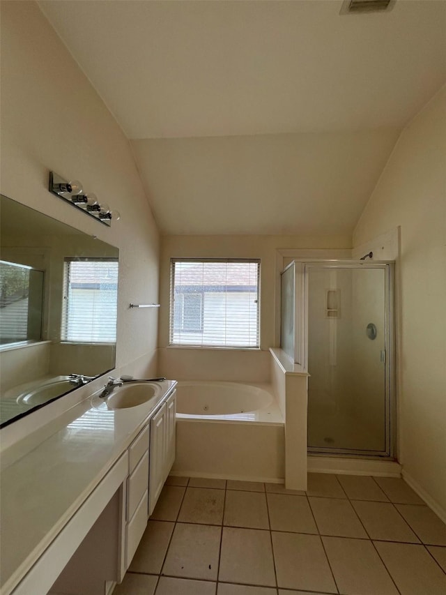 20019 Sterling Meadow Ct, Katy, TX 77449 - full bath featuring lofted ceiling, a whirlpool tub, tile patterned floors, vanity, and a shower stall