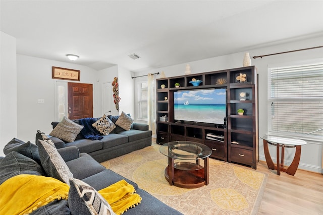 7622 Crestbrook Manor Ln, Cypress, TX 77433 - living area featuring light wood finished floors and plenty of natural light