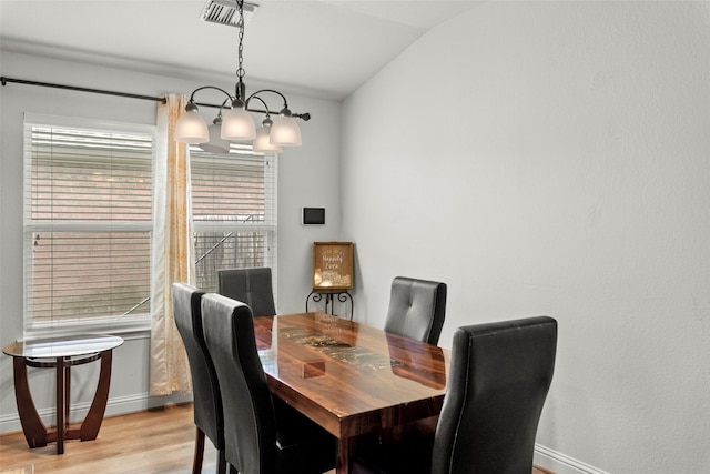 7622 Crestbrook Manor Ln, Cypress, TX 77433 - dining space with lofted ceiling, light wood-style floors, and a chandelier