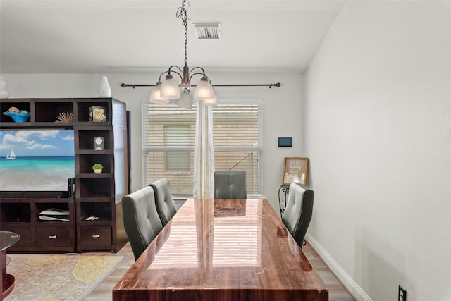 7622 Crestbrook Manor Ln, Cypress, TX 77433 - dining space with a chandelier and wood finished floors