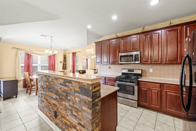 7622 Crestbrook Manor Ln, Cypress, TX 77433 - kitchen with stainless steel appliances, a center island, light tile patterned flooring, backsplash, and vaulted ceiling