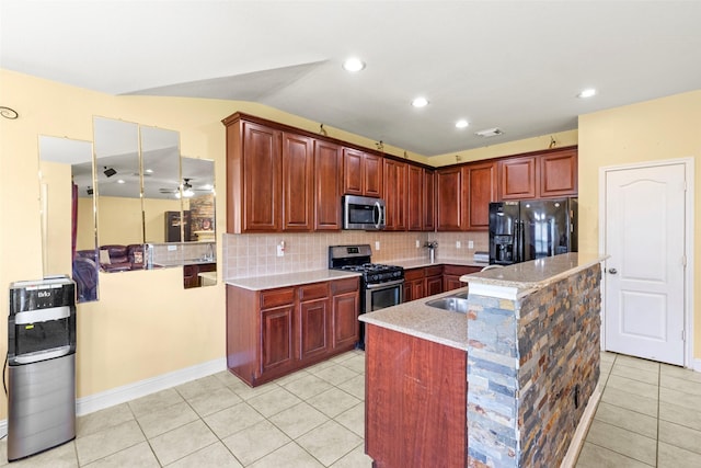 7622 Crestbrook Manor Ln, Cypress, TX 77433 - kitchen featuring appliances with stainless steel finishes, light tile patterned flooring, decorative backsplash, recessed lighting, and lofted ceiling