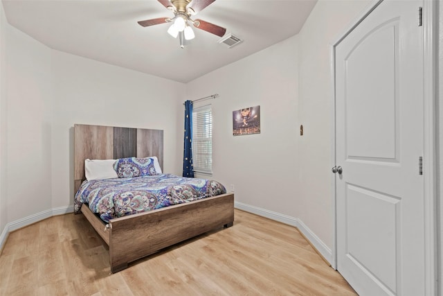 7622 Crestbrook Manor Ln, Cypress, TX 77433 - bedroom with light wood-style floors and a ceiling fan