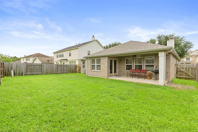 7622 Crestbrook Manor Ln, Cypress, TX 77433 - back of property featuring brick siding, a fenced backyard, a chimney, and a patio