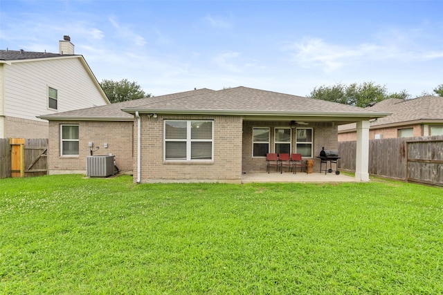 7622 Crestbrook Manor Ln, Cypress, TX 77433 - rear view of property featuring a patio area, brick siding, a fenced backyard, and roof with shingles