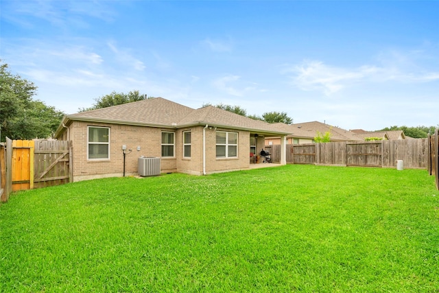 7622 Crestbrook Manor Ln, Cypress, TX 77433 - back of house featuring a fenced backyard, a patio area, and brick siding