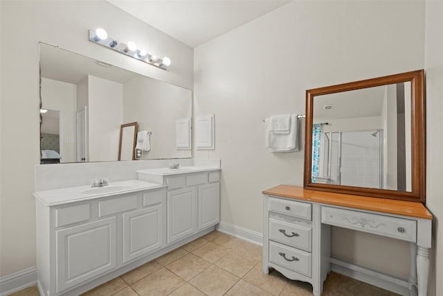 7622 Crestbrook Manor Ln, Cypress, TX 77433 - ensuite bathroom featuring double vanity, tile patterned flooring, and an enclosed shower