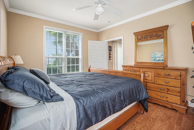 7000 Seawall Blvd Unit 611, Galveston, TX 77551 - bedroom with wood finished floors, ornamental molding, and ceiling fan