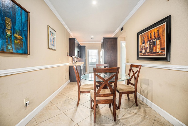 7000 Seawall Blvd Unit 611, Galveston, TX 77551 - dining room with crown molding, light tile patterned flooring, and recessed lighting