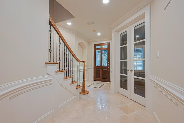 2616 Helena St, Houston, TX 77006 - foyer featuring a decorative wall, crown molding, french doors, stairway, and recessed lighting