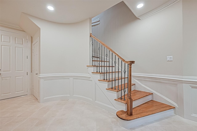 2616 Helena St, Houston, TX 77006 - stairs featuring a decorative wall, wainscoting, recessed lighting, and tile patterned flooring