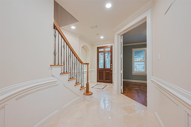 2616 Helena St, Houston, TX 77006 - foyer featuring crown molding, a decorative wall, stairway, wainscoting, and recessed lighting