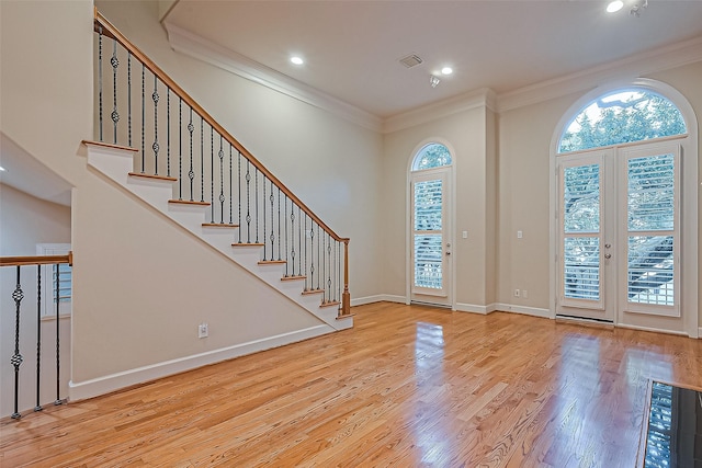 2616 Helena St, Houston, TX 77006 - foyer with ornamental molding, wood finished floors, recessed lighting, and stairs