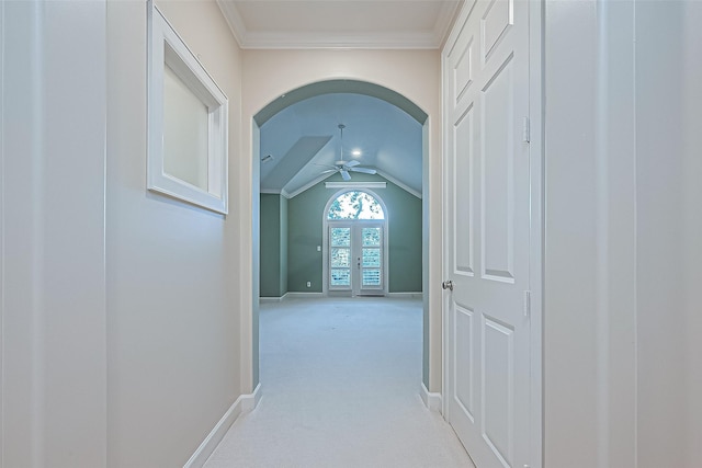 2616 Helena St, Houston, TX 77006 - hall featuring arched walkways, light colored carpet, crown molding, lofted ceiling, and french doors