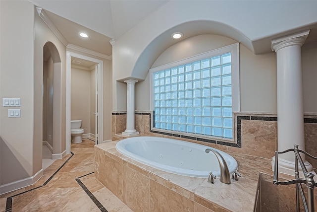 2616 Helena St, Houston, TX 77006 - bathroom with inlaid floor details, decorative columns, crown molding, a jetted tub, and recessed lighting