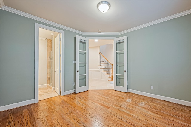 2616 Helena St, Houston, TX 77006 - unfurnished room with french doors, ornamental molding, wood finished floors, and stairway