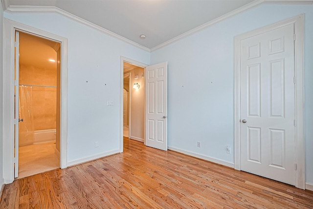 2616 Helena St, Houston, TX 77006 - unfurnished bedroom with light wood finished floors, ensuite bathroom, crown molding, and lofted ceiling