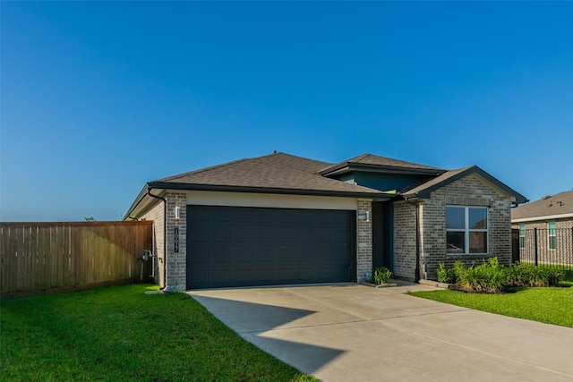 10627 Great Basin Dr, Rosharon, TX 77583 - view of front of property with brick siding, an attached garage, driveway, and a shingled roof