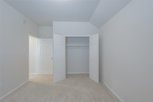 6511 Harcourt Bridge Dr, Houston, TX 77084 - unfurnished bedroom with light carpet, a closet, and vaulted ceiling
