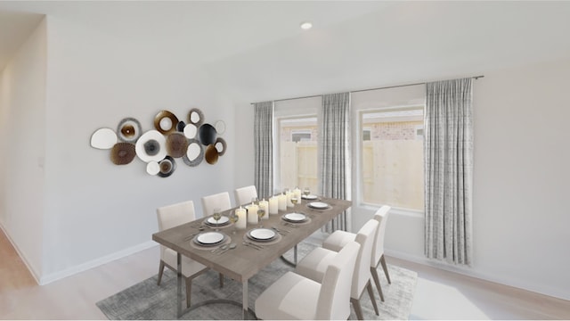3001 Wild Dunes Dr, Katy, TX 77493 - dining area with light wood-style flooring and baseboards