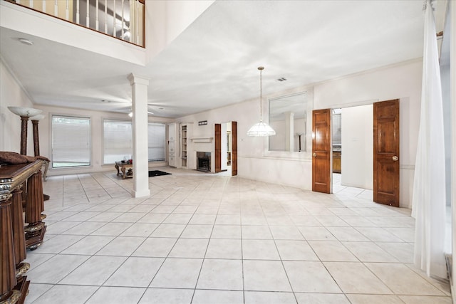 3507 Shanemoss Ct, Houston, TX 77068 - unfurnished living room with decorative columns, a fireplace, and light tile patterned floors