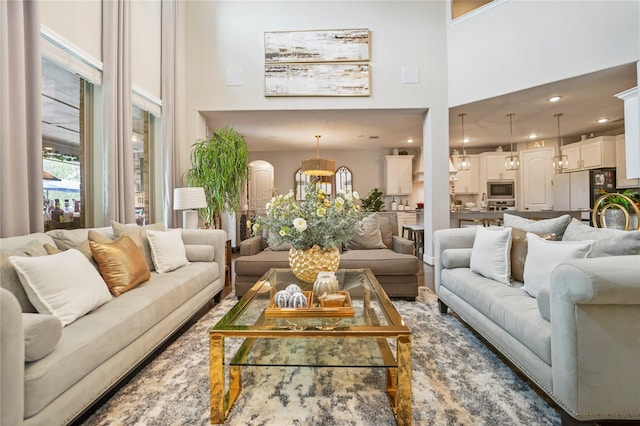 13526 Wedgewood Thicket Way, Cypress, TX 77429 - living room with a high ceiling, a chandelier, and recessed lighting