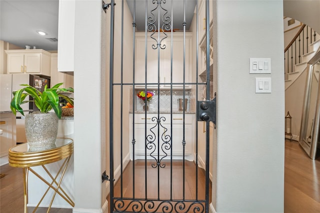 13526 Wedgewood Thicket Way, Cypress, TX 77429 - detailed view of wood finished floors and freestanding refrigerator