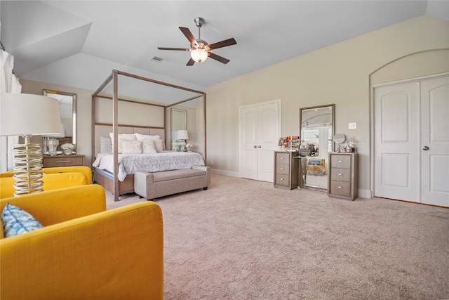 13526 Wedgewood Thicket Way, Cypress, TX 77429 - carpeted bedroom featuring two closets, vaulted ceiling, and a ceiling fan