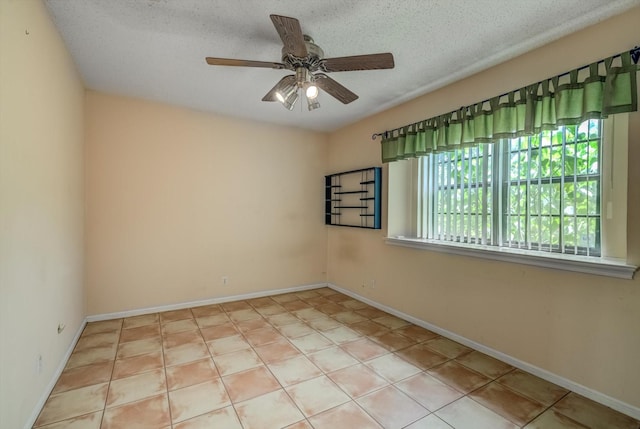 414 Daffodil St, Lake Jackson, TX 77566 - spare room with ceiling fan, a textured ceiling, and tile patterned flooring