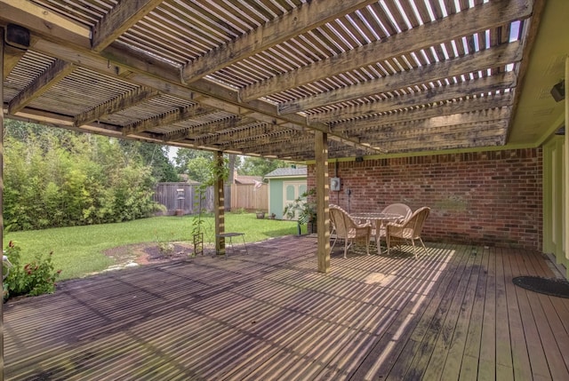 414 Daffodil St, Lake Jackson, TX 77566 - wooden terrace with a fenced backyard, outdoor dining area, a pergola, and a shed