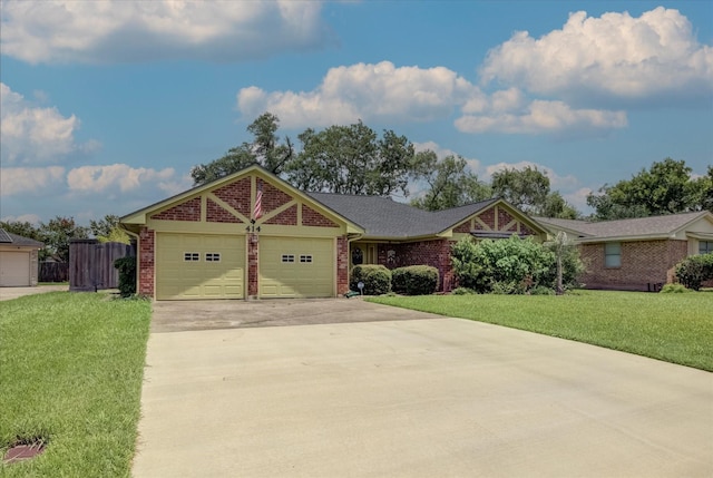 414 Daffodil St, Lake Jackson, TX 77566 - ranch-style house featuring brick siding, a garage, and driveway