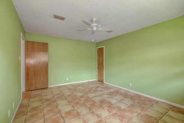 414 Daffodil St, Lake Jackson, TX 77566 - spare room featuring ceiling fan and a textured ceiling