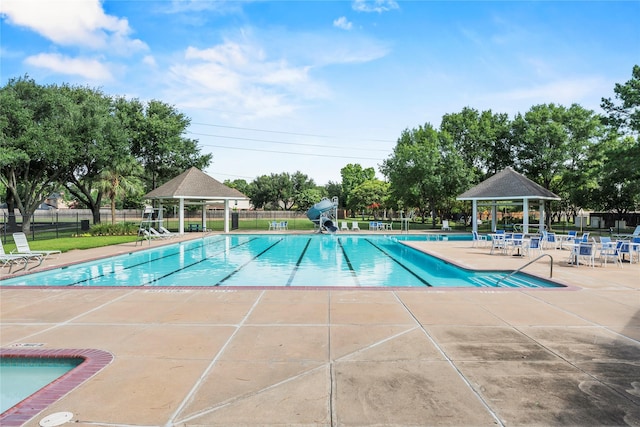 7331 Hazel Cove Dr, Houston, TX 77095 - community pool featuring a gazebo, a patio area, and a water slide