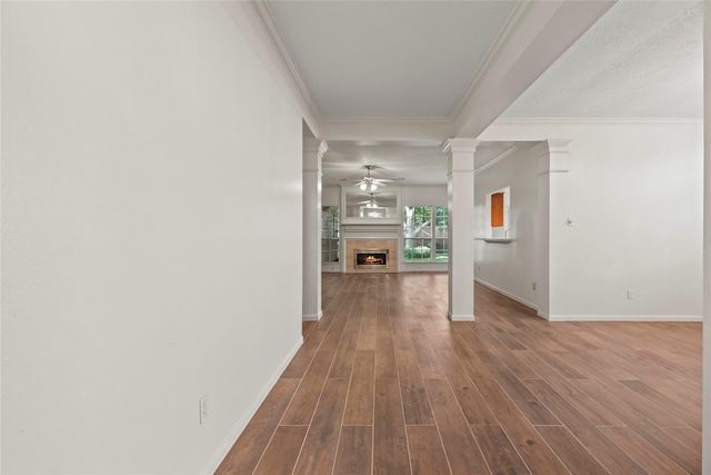 7331 Hazel Cove Dr, Houston, TX 77095 - hallway with decorative columns, wood finished floors, and ornamental molding