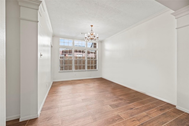 7331 Hazel Cove Dr, Houston, TX 77095 - unfurnished dining area with a chandelier, crown molding, a textured ceiling, and wood finished floors