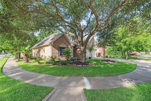 7331 Hazel Cove Dr, Houston, TX 77095 - view of front of property featuring brick siding and a front yard
