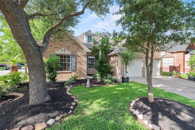 7331 Hazel Cove Dr, Houston, TX 77095 - view of front of home with brick siding, concrete driveway, a front lawn, and an attached garage