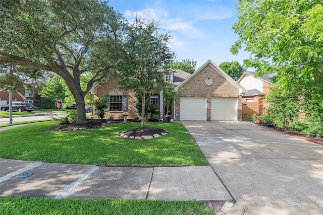 7331 Hazel Cove Dr, Houston, TX 77095 - obstructed view of property with brick siding, a garage, a front lawn, and driveway
