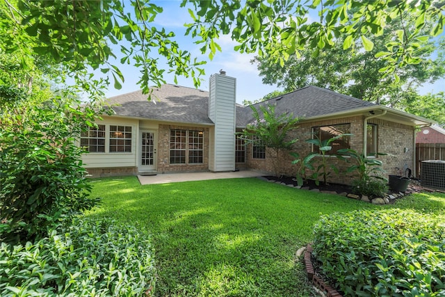 7331 Hazel Cove Dr, Houston, TX 77095 - rear view of property featuring brick siding, a chimney, a patio, and roof with shingles