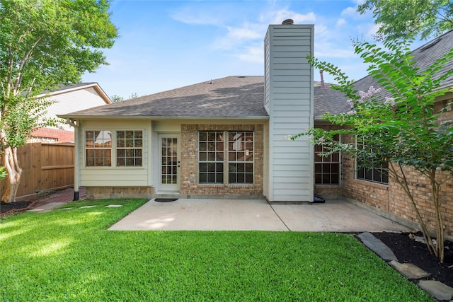 7331 Hazel Cove Dr, Houston, TX 77095 - back of property with a shingled roof, a patio area, a chimney, and brick siding