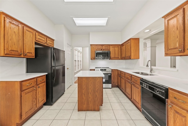 7331 Hazel Cove Dr, Houston, TX 77095 - kitchen featuring black appliances, a kitchen island, brown cabinets, and light countertops
