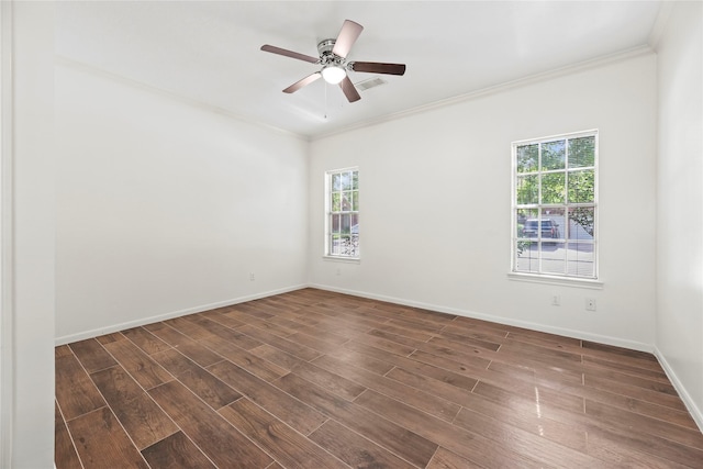 7331 Hazel Cove Dr, Houston, TX 77095 - empty room featuring plenty of natural light, dark wood finished floors, crown molding, and a ceiling fan