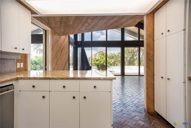 1809 W Harrison Ave, Port O Connor, TX 77982 - kitchen featuring plenty of natural light, a peninsula, and white cabinets