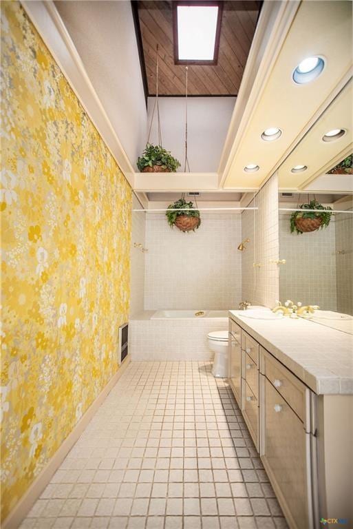 1809 W Harrison Ave, Port O Connor, TX 77982 - bathroom with wallpapered walls, a garden tub, tile patterned floors, vanity, and recessed lighting