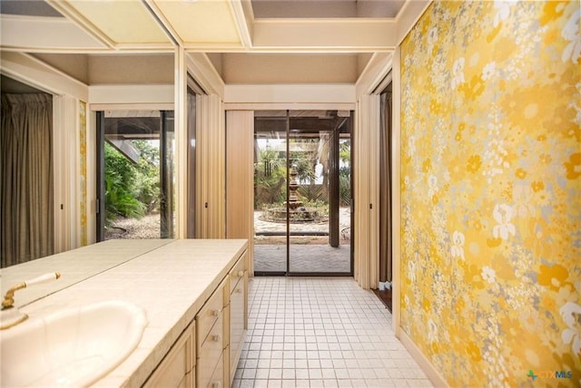 1809 W Harrison Ave, Port O Connor, TX 77982 - bathroom featuring wallpapered walls, vanity, and tile patterned floors