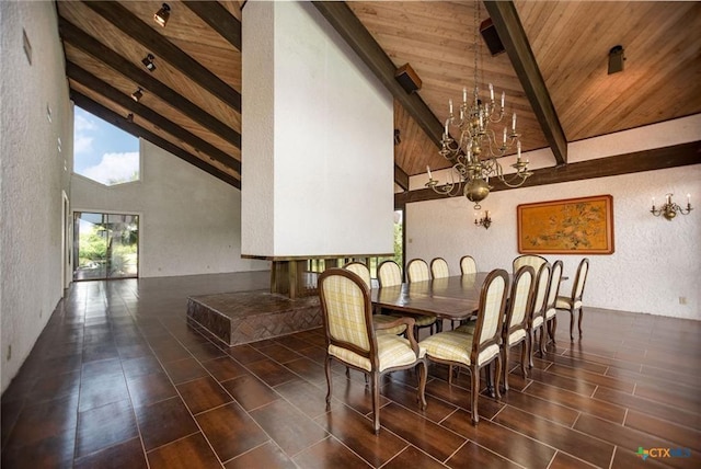 1809 W Harrison Ave, Port O Connor, TX 77982 - dining room featuring a textured wall, a wooden ceiling with exposed beams, a chandelier, and high vaulted ceiling