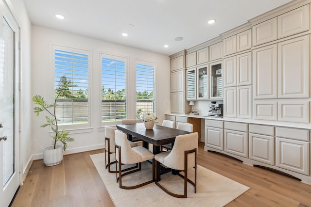 21514 Sunny Riverbank Cir, Cypress, TX 77433 - dining space with light wood-style flooring and recessed lighting